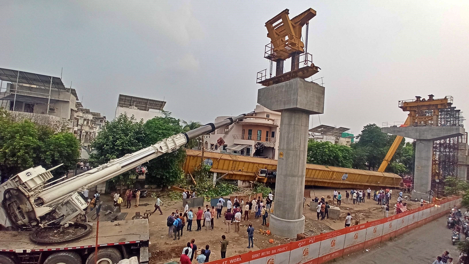 surat metro project crane collapses on building during metro construction no casualties br3