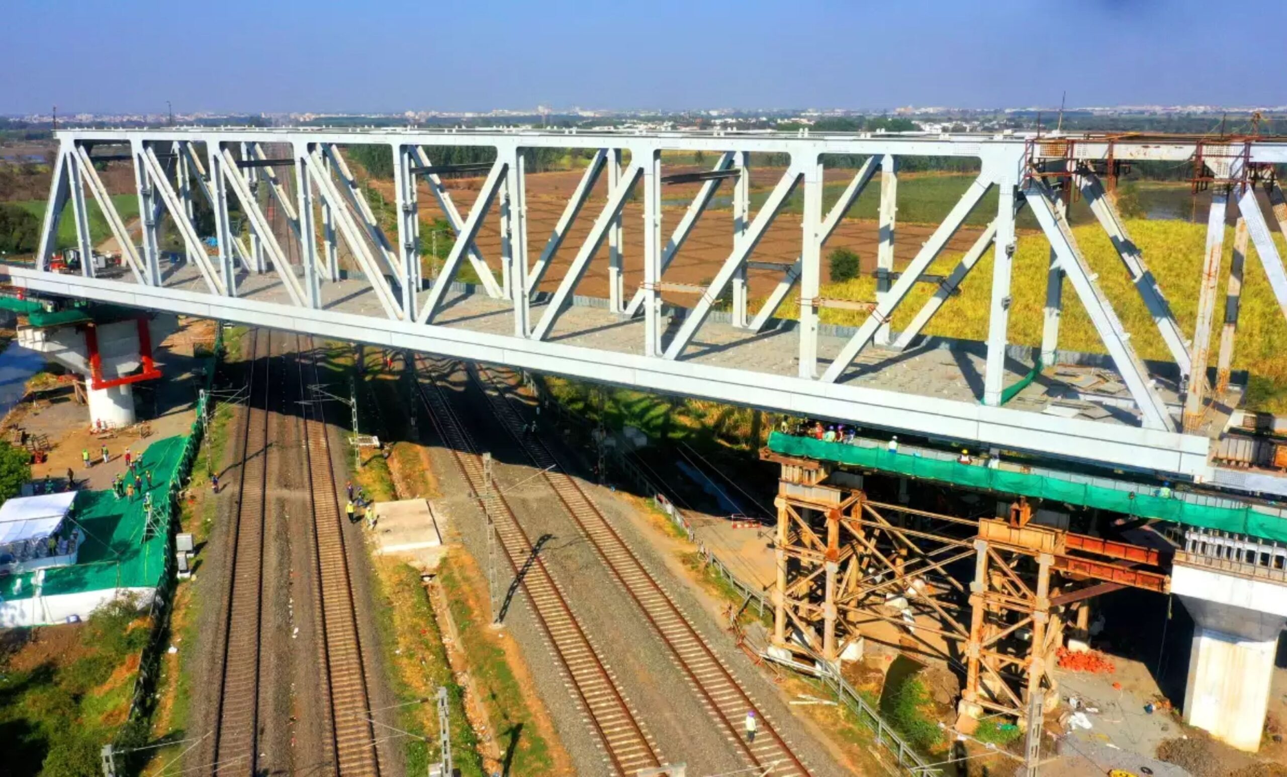 mumbai ahmedabad bullet train project 100 meter long steel girder lowered on four railway tracks in gujarat1