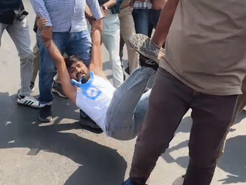 NSUI workers appear half naked drugs alcohol protest at Rajkot Kishanpara Chowk chaos